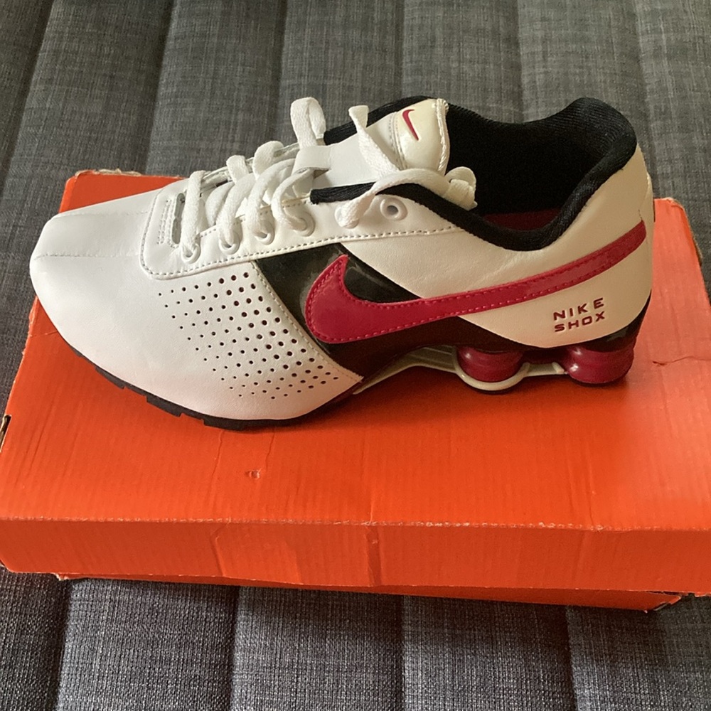 Pink and white Nike Shox